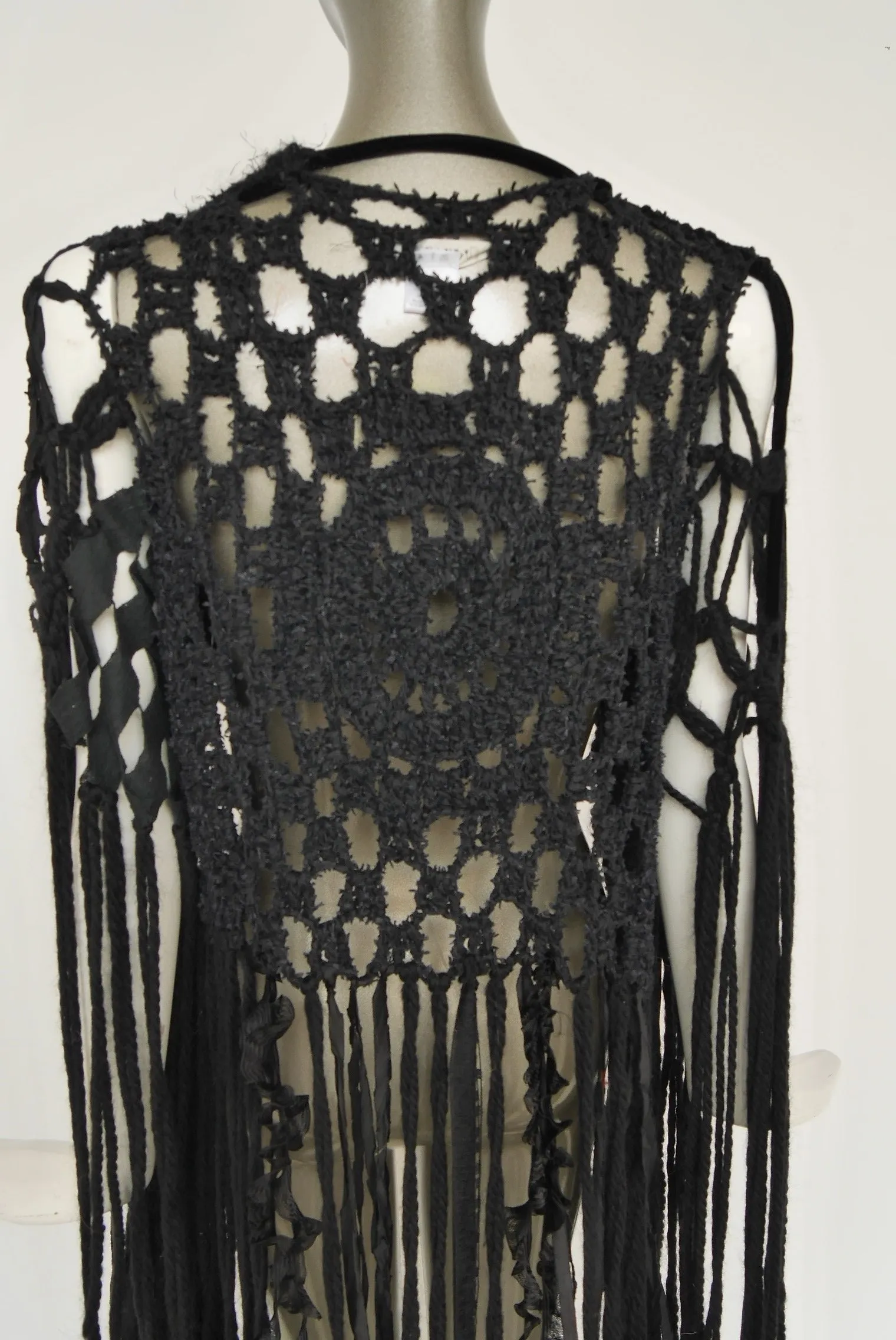 Slashed Bohemian style knit vest by Rodarte